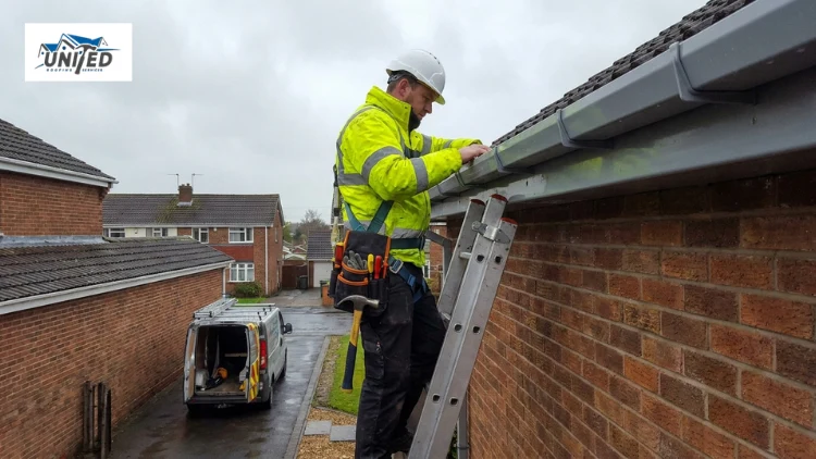roofer insecting leaking gutter